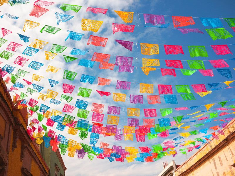 Papel Picado Displays Draped Across Streets