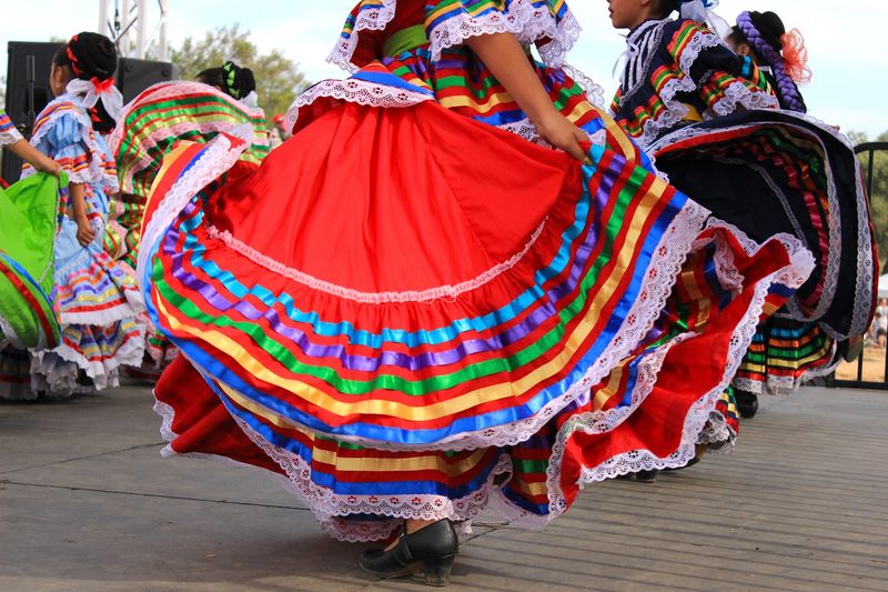 Parades Filled With Bright Costumes And Folklórico Dancers