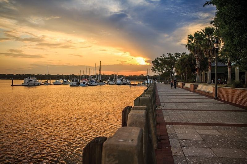 Watching The Sunset From The Waterfront Park Dock