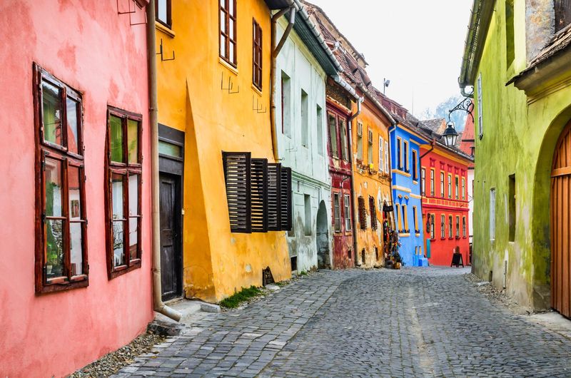 Wander Cobblestone Streets In A Colorful Historic Town