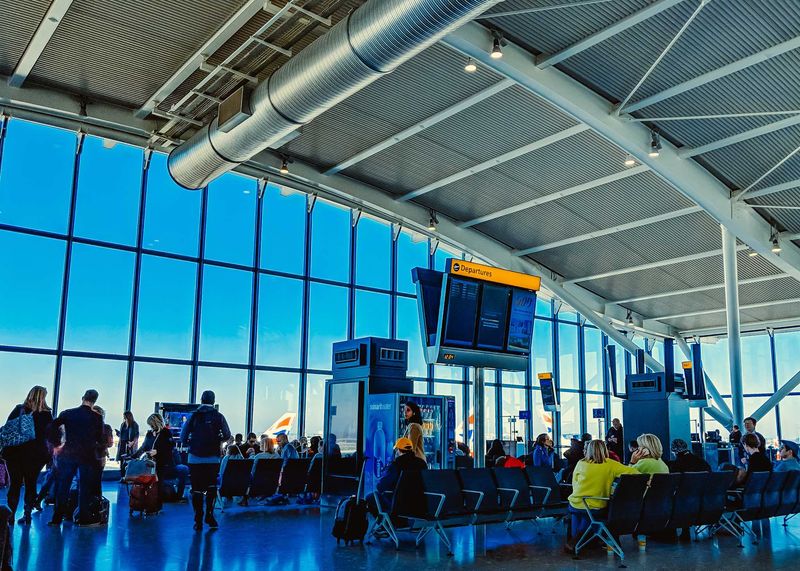 Making last-minute bathroom or shopping trips just before boarding begins